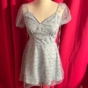 A blue glitter butterfly dress